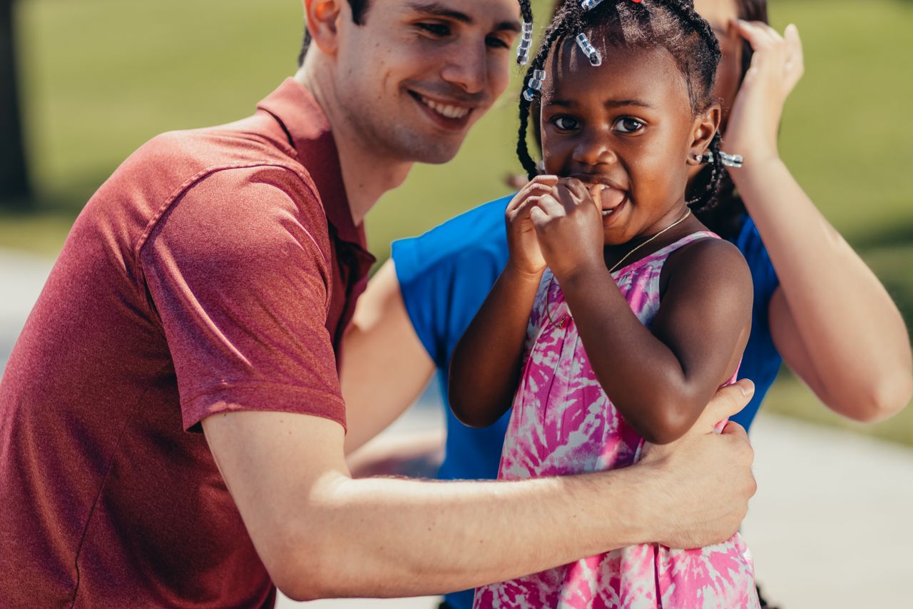 Crafting Captivating Headlines: Your awesome post title goes here A joyful mixed family bonding and enjoying quality time outdoors.